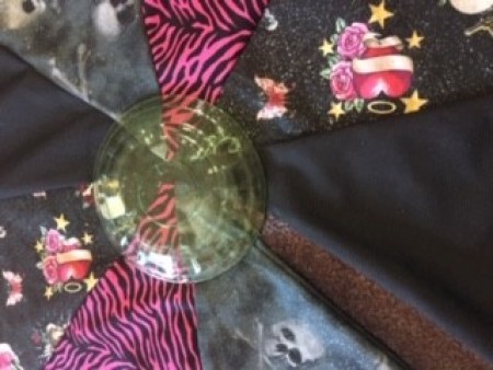 Marking a hole in the tree skirt.