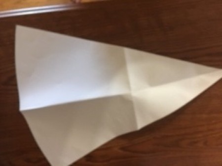 Cutting out a triangular pattern.