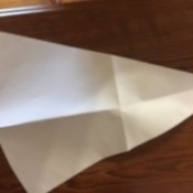 Cutting out a triangular pattern.