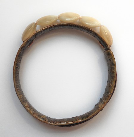 Adding beads to the top of the bangle.