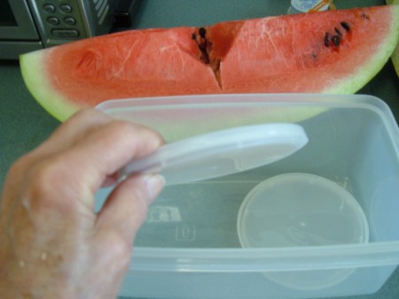 Adding lids to the bottom of plastic containers.