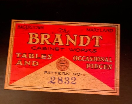 The Brandt logo on a piece of furniture.