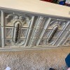 A Bassett dresser with an ornate front.
