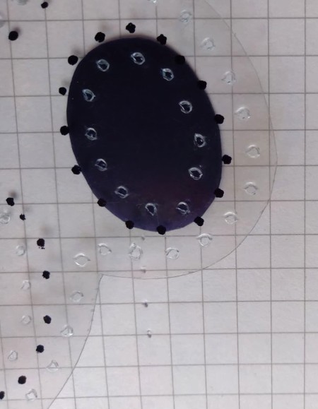 Poking holes through the plastic.