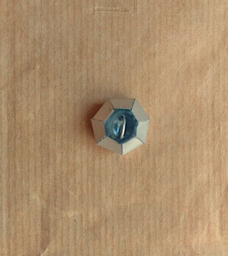 Attaching the loop to the button.