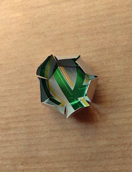 Folding up the sides of the button.