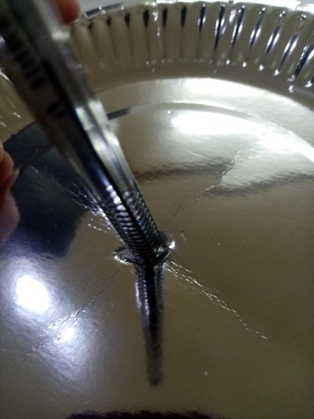 Making a hole in the center of a plate.