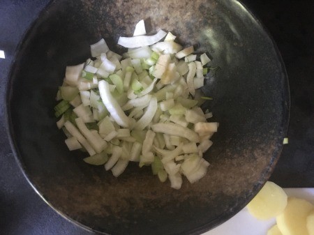 Sauteing onions in a pan.