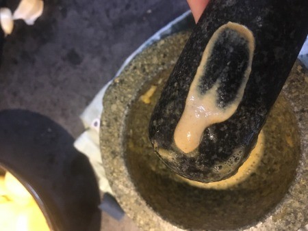 Making garlic aioli.