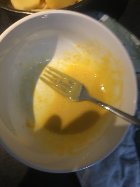 Making garlic aioli.