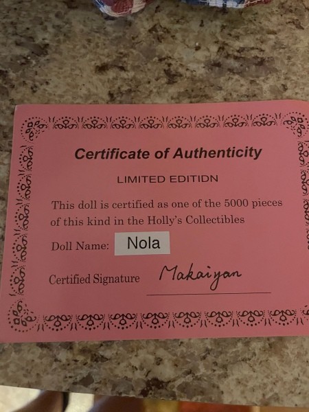A doll's certificate of authencity.