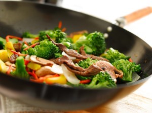 A wok stir frying vegetables.
