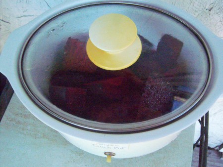 Cooking the beets in a slow cooker.