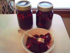 The canned beets and a bowl full of the pickled beets.