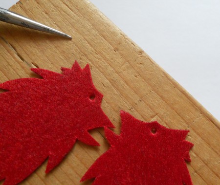 Creating a hole in the top of the feathers.