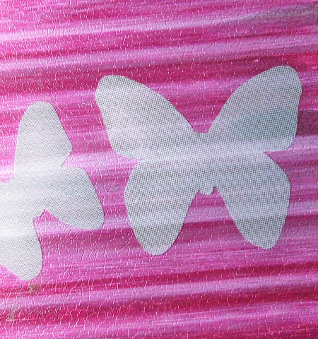 Cutting out the butterfly shapes.