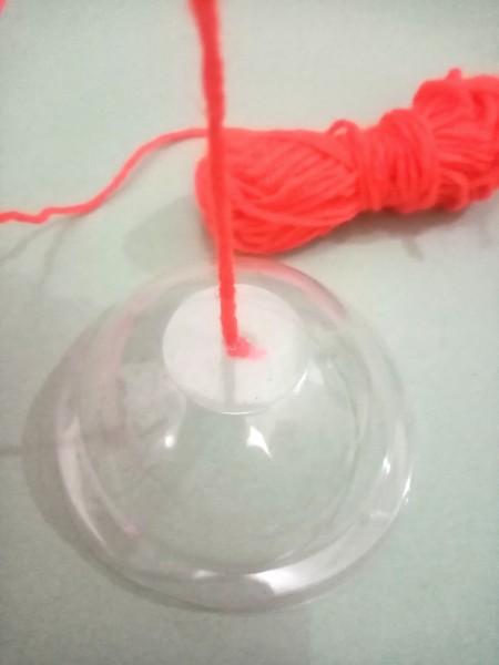 Attaching yarn to the dome lid.