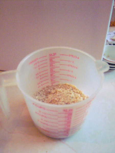 A measuring cup full of almond flour.