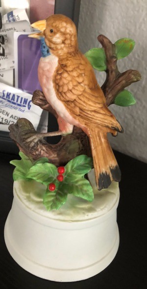 A ceramic bird music box.