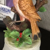 A ceramic bird music box.