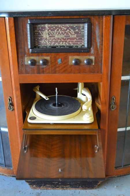 A console stereo cabinet with a record player.