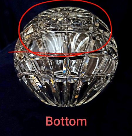 The bottom of a crystal rose bowl.