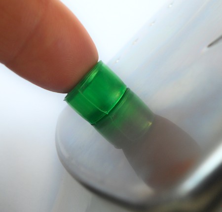 Placing the plastic bead on an iron to melt it.