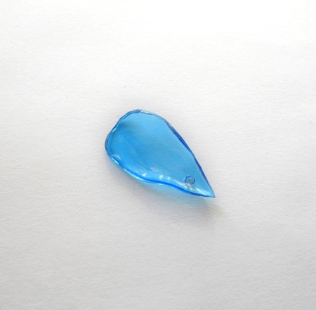 Putting a hole in the end of the petal.