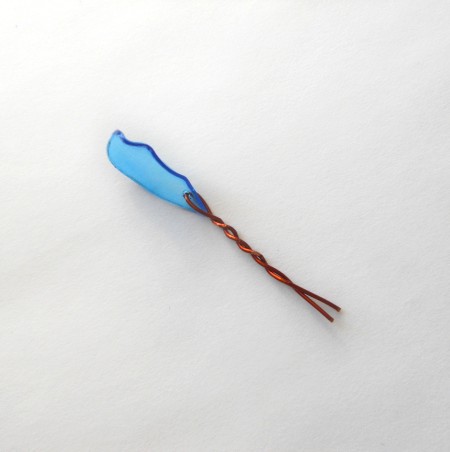 The petal attached to a piece of wire.