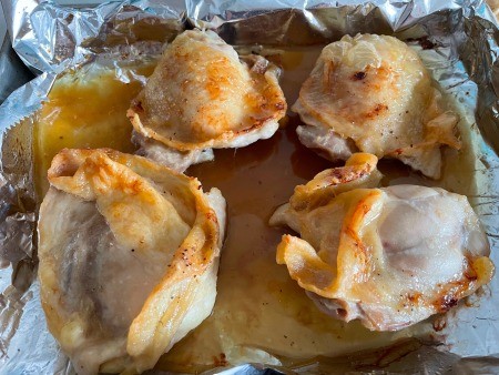 The cooked chicken pieces.