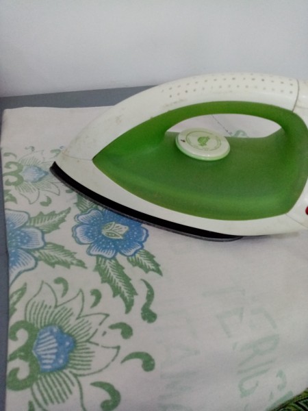 Using an iron to melt the plastic.