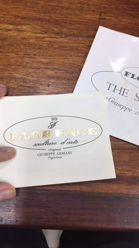 Paperwork packaged with figurines.