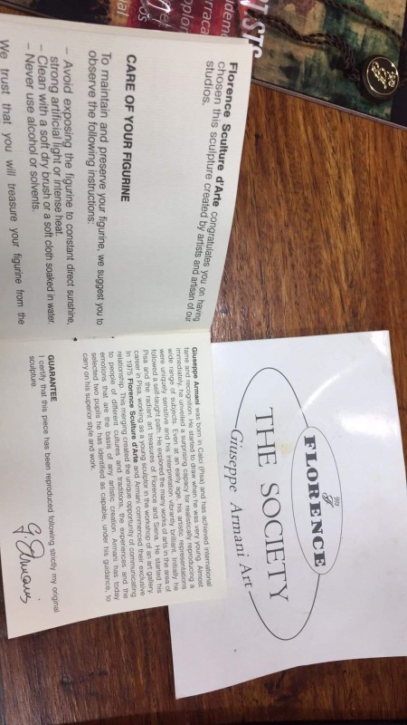 Paperwork packaged with figurines.