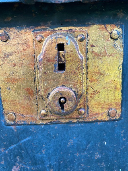 The lock on a steamer trunk.