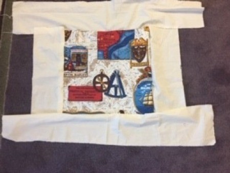 Adding muslin strips to the edges of the artwork.