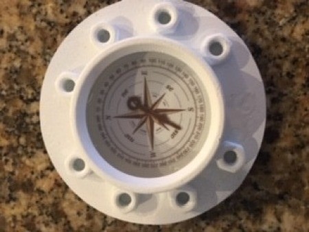 Adding the hardware to the compass rose.