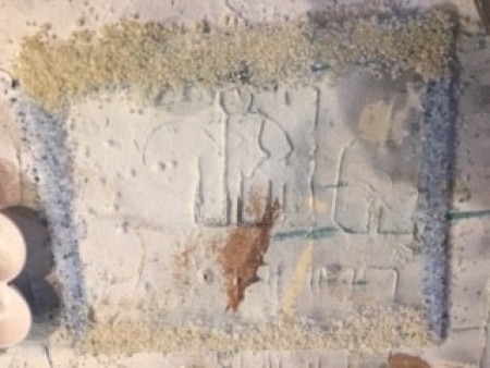 Adding sand to the glass.