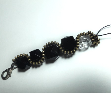 Adding beads to the zipper.