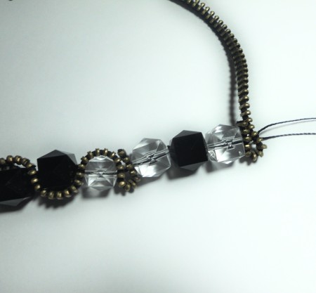 Adding the second piece of zipper to the bracelet.