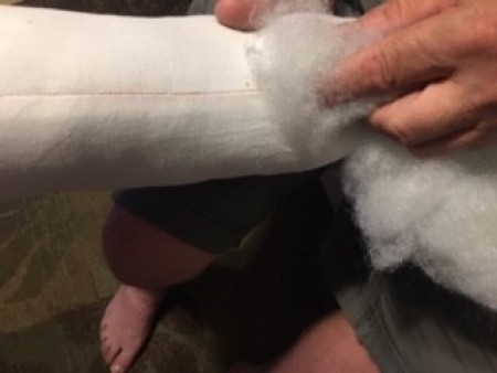 Stuffing the bolster.