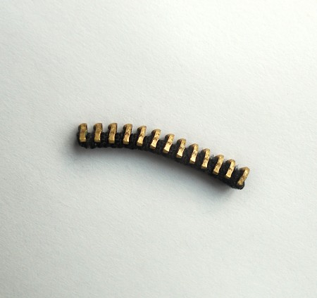A small length of metal zipper.