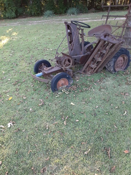 A rusted piece of farm equipment.