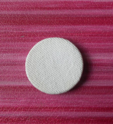 Covering the plastic with the white denim.