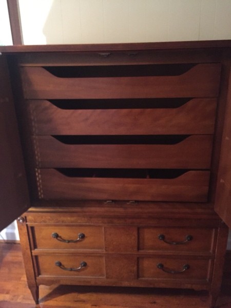 A wooden chest of drawers.