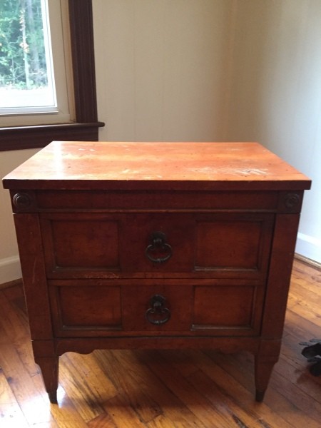A wooden nightstand.