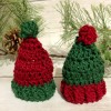 Two crocheted Christmas hats.