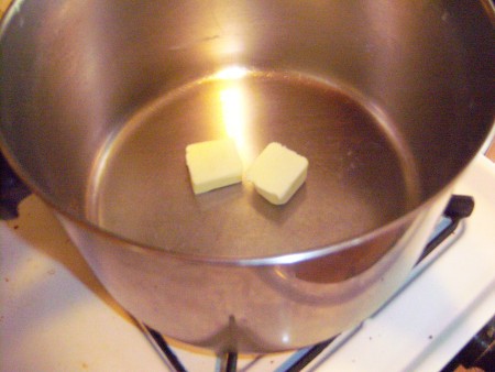 Melting butter in the soup pot.