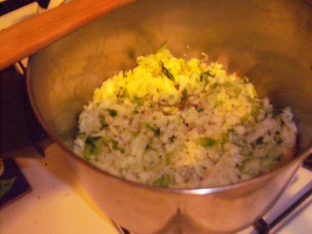 Adding the chopped veggies to the pot.