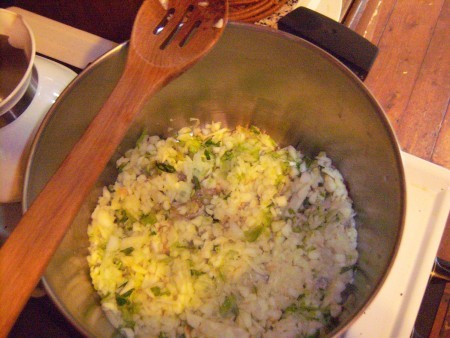 Cooking the apples and vegetables in the soup pot.