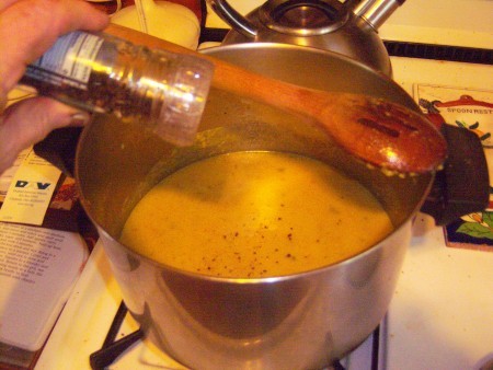 Adding pepper to the bisque.